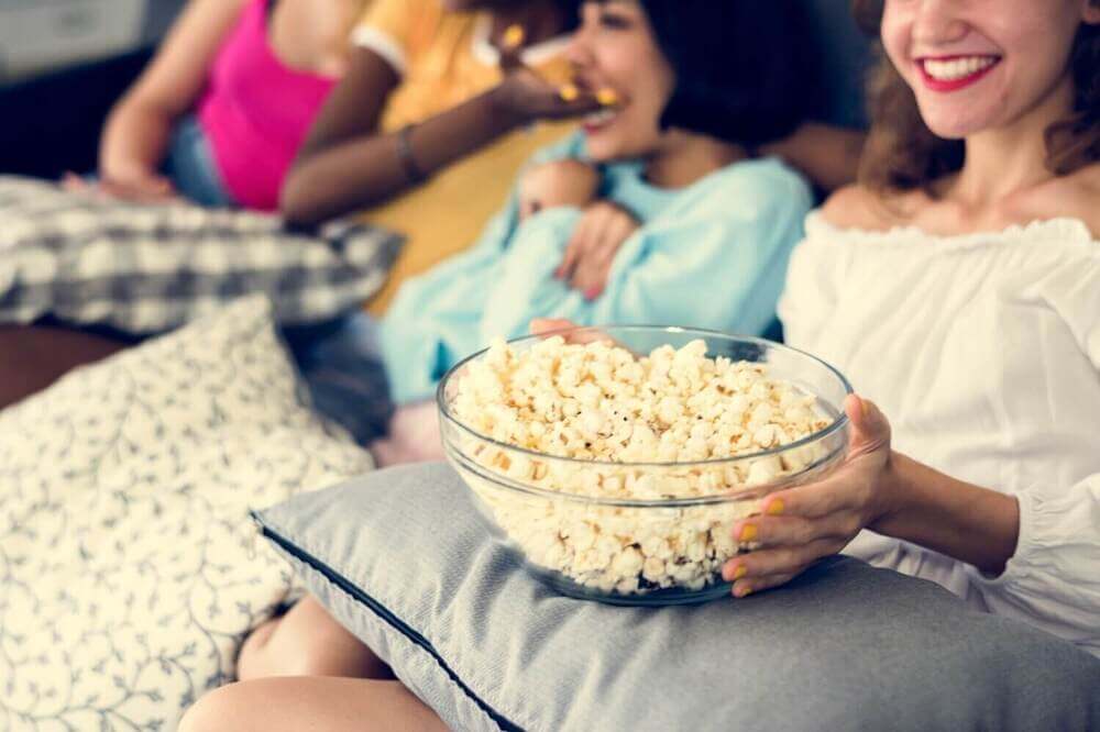 Roommates Enjoying Popcorn.