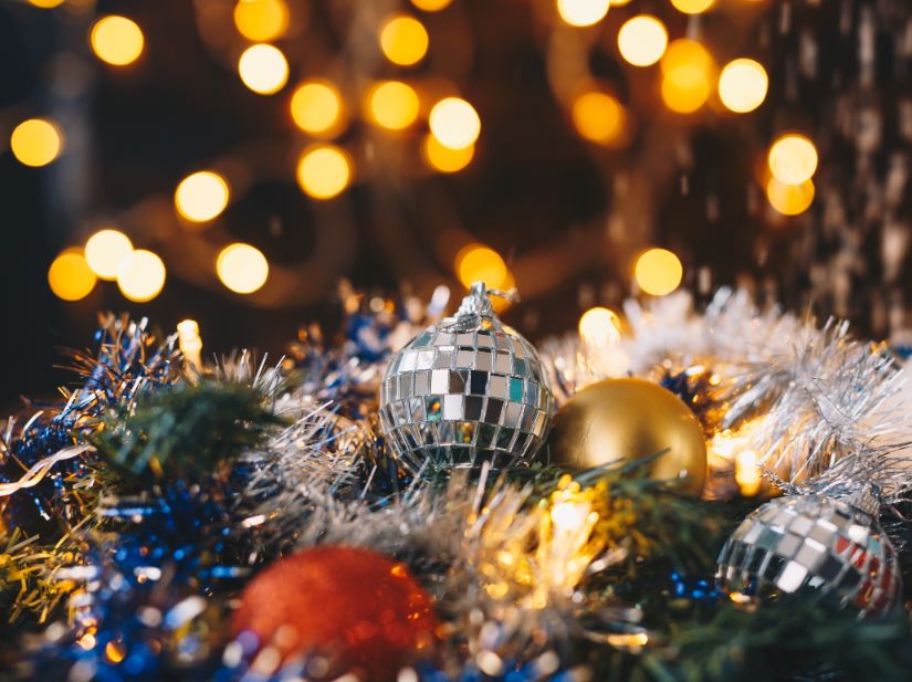 Christmas lights and ornaments on a Christmas tree.