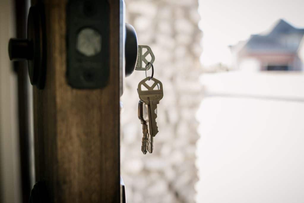 House keys dangling on sober living door.